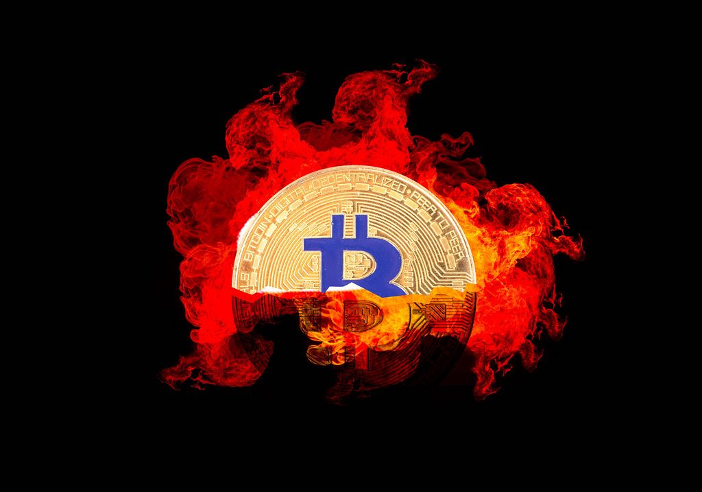 Bitcoin crypto with fire isolated on black background