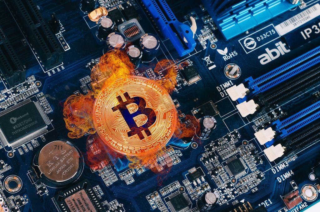 Bitcoin on fire on computer parts