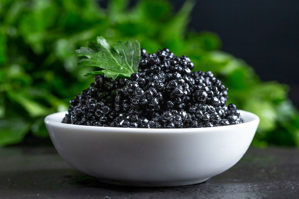 Black caviar in a white bowl (Flip 2019)