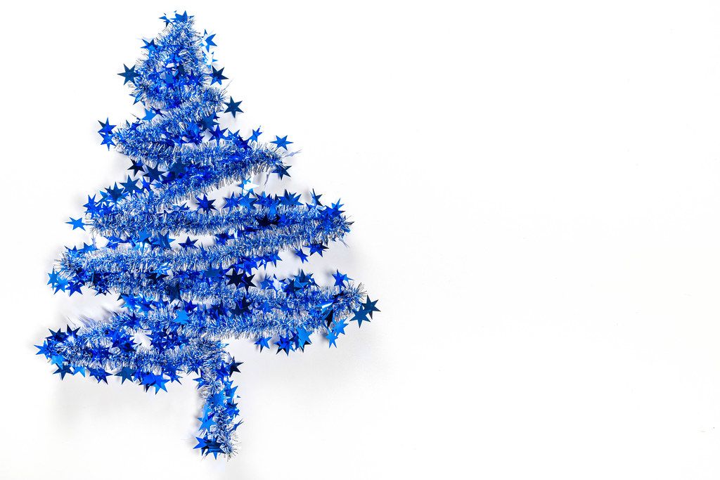 Blue christmas tree on white background with free space