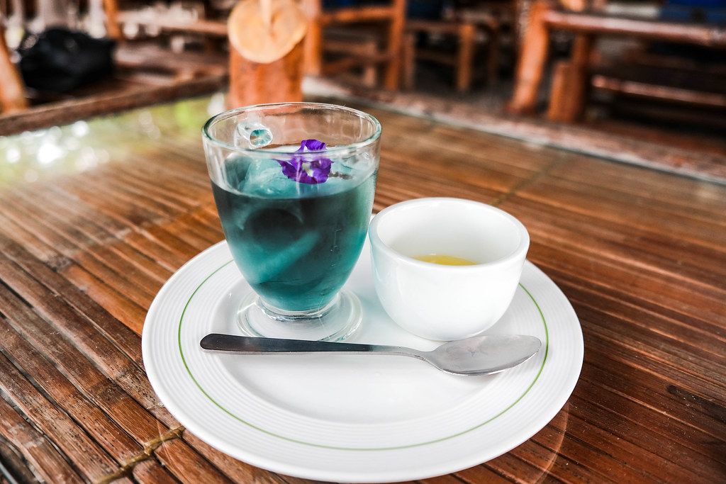 Blue colored iced mint tea with sugar syrup