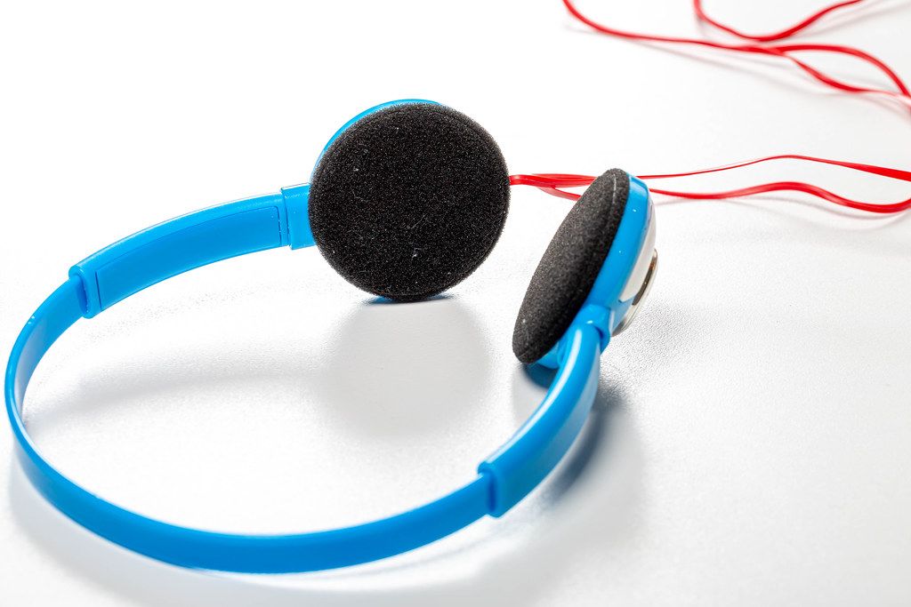 Blue headphones on white background (Flip 2019)