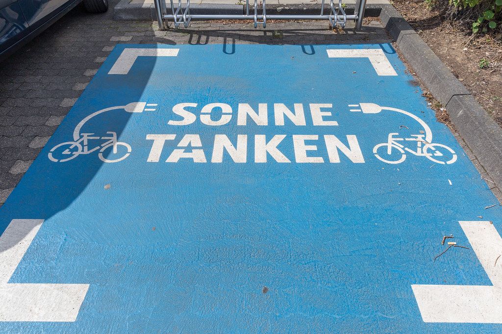 Blue Parking lot for electric bicycles / e-bikes at a German Aldi-Süd supermarket parking lot