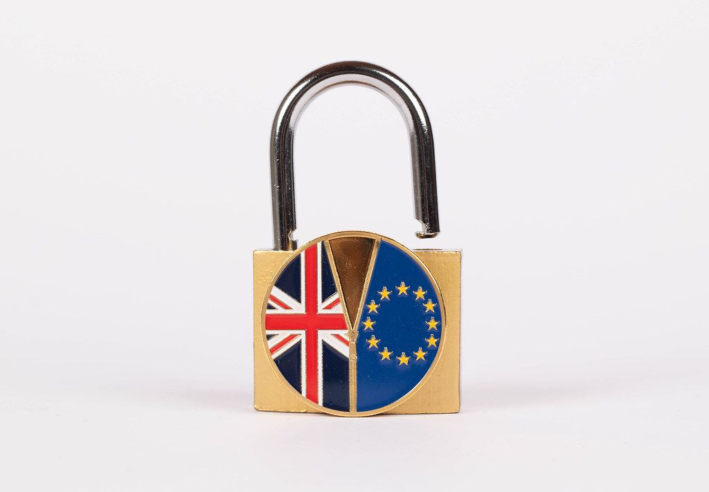 Brexit medal coin with padlock on white background