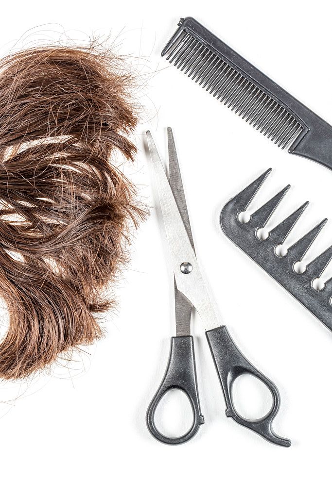 Brown hair with scissors and combs, top view