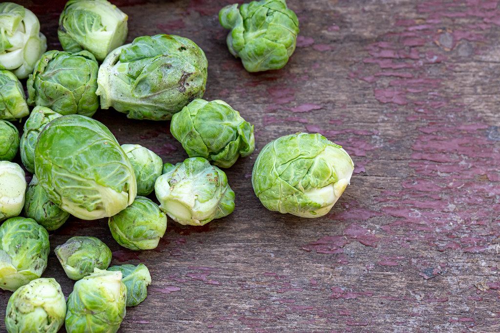 Brussels sprouts on old wooden background