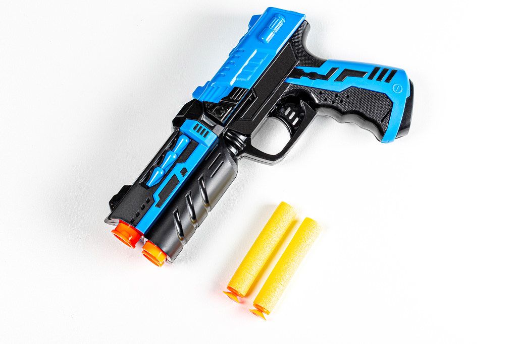 Children's plastic pistol with cartridges