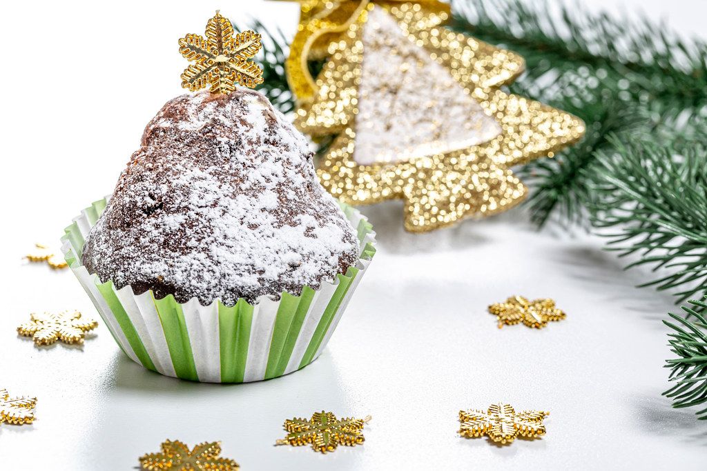 Chocolate cupcake on christmas background