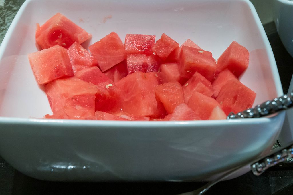 Chopped watermelon in white bowl