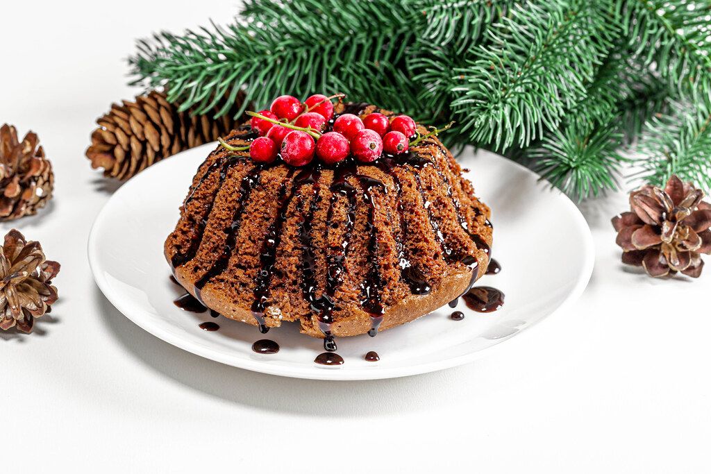 Christmas chocolate cupcake with red currants and Christmas decor