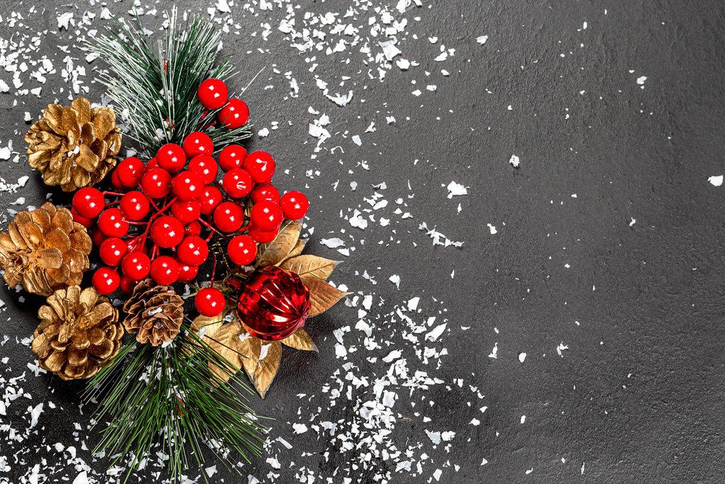 Christmas decor on black background with snow and free space