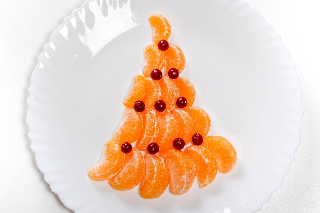 Christmas tree made from mandarin and cranberries