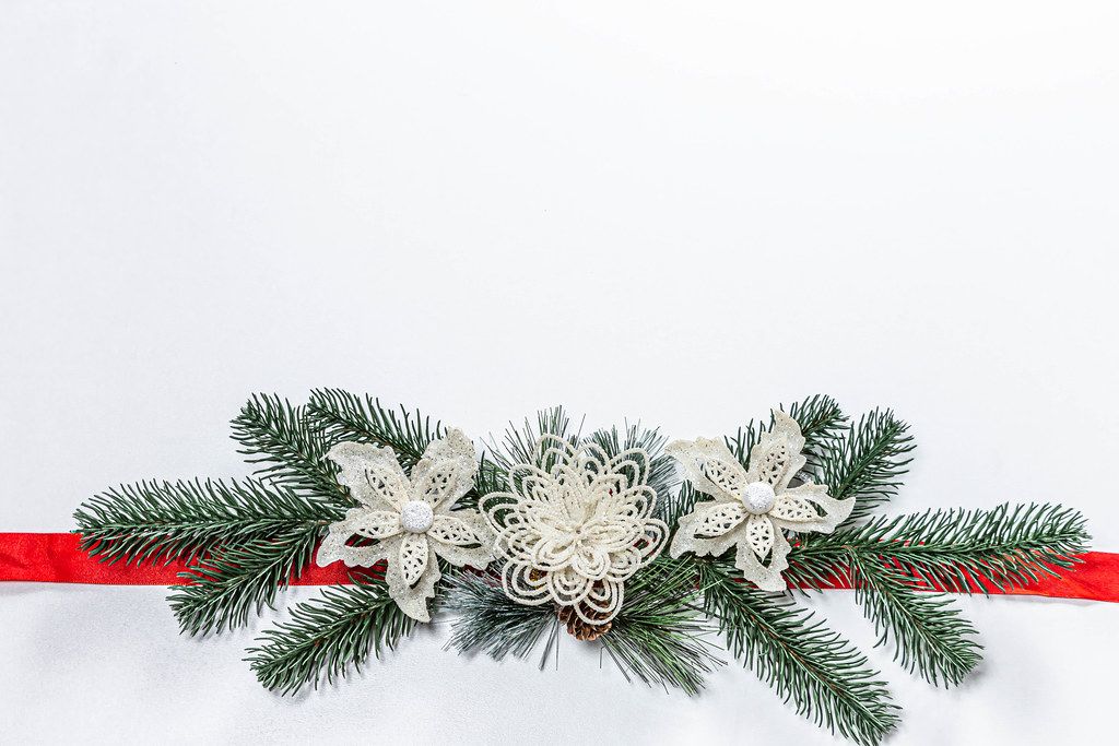 Christmas white background with Christmas tree branches, decor and red ribbon (Flip 2019)
