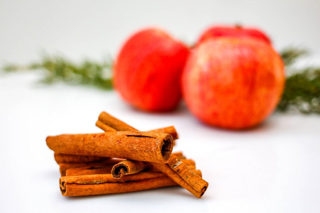 Cinnamon Stick and Apple on a White Background