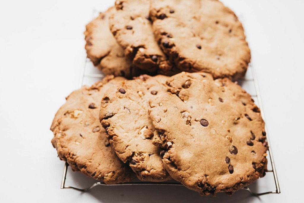 Close of of big chocolate cookies on white background.