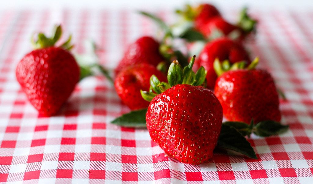 Close Up Bokeh Photo of Fresh Strawberries on Kitchen Cloth