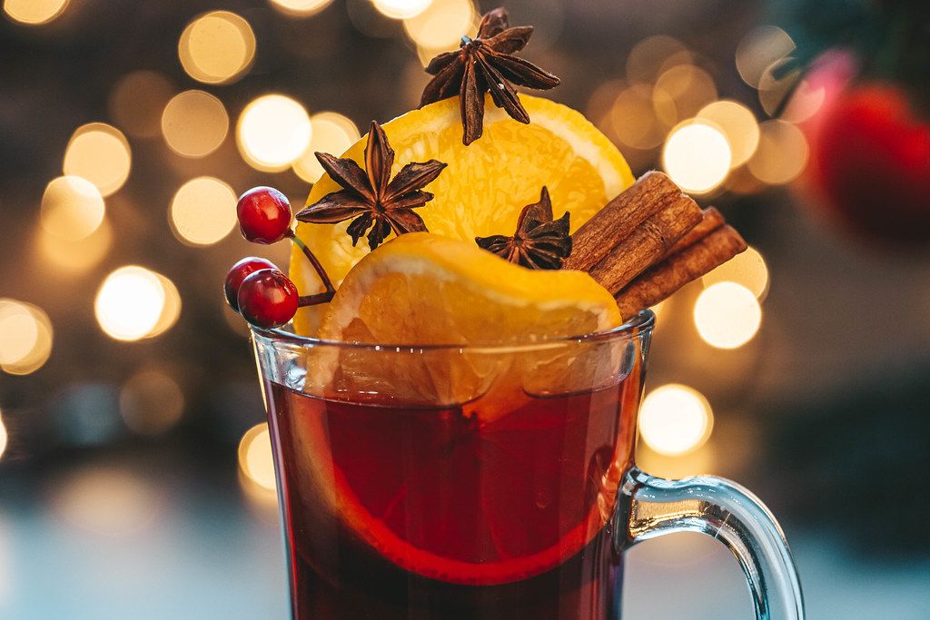 Close-up glass of mulled wine on a Christmas background