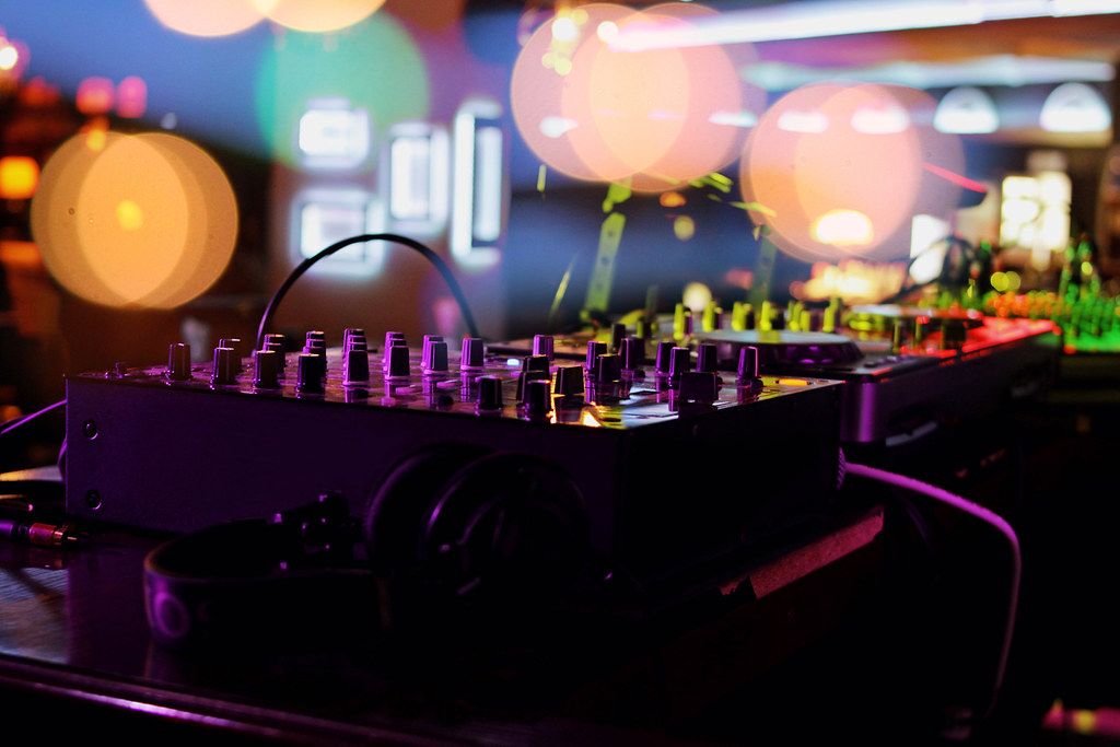 Close up of a DJ turntable in a small event location at night