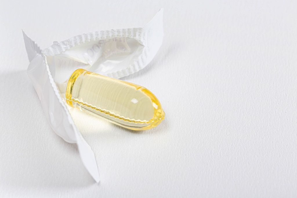 Close-up of an open suppository on a white background
