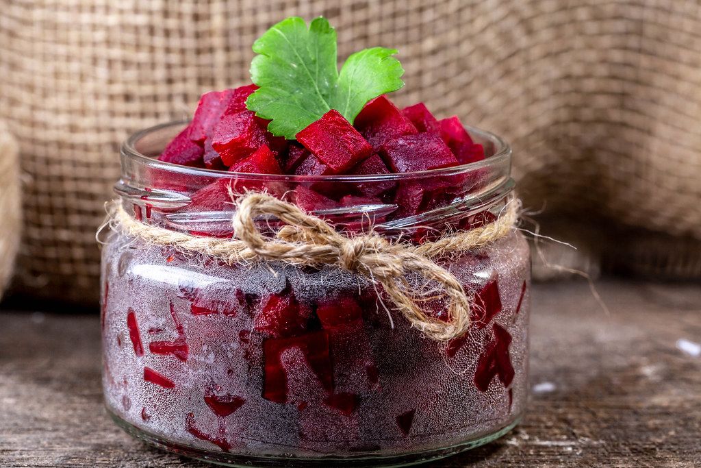 Close-up of boiled beet salad in a glass jar