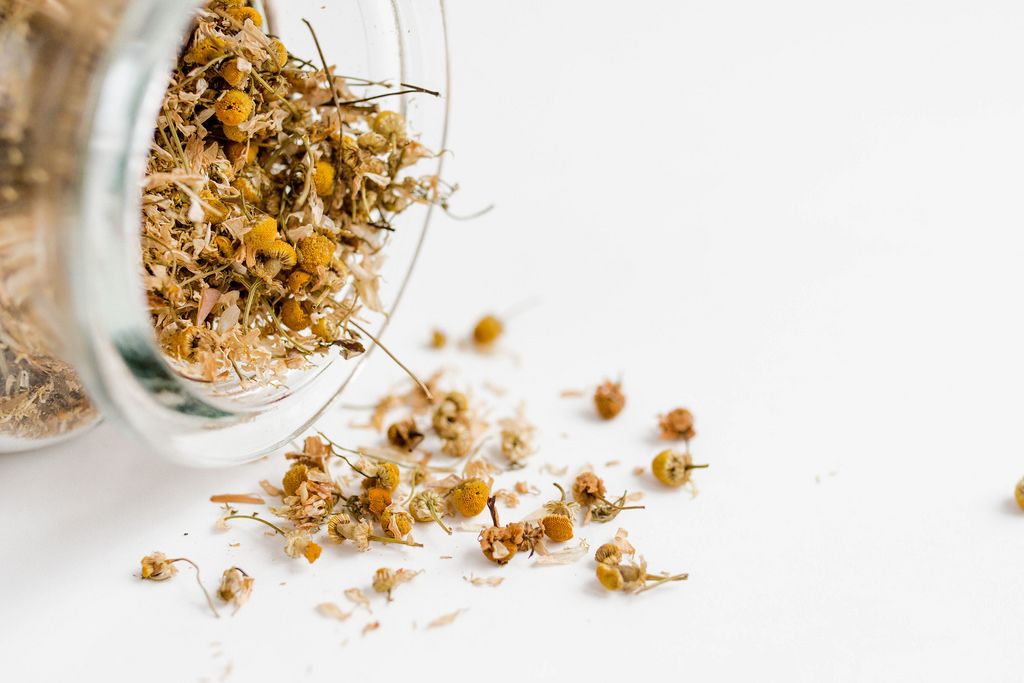 Close up of dry chamomile in a jar
