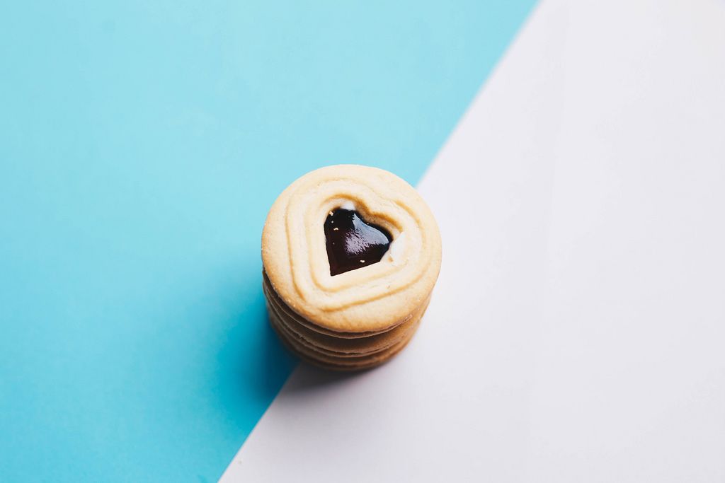 Close up of heart shaped cookies on colorful background.