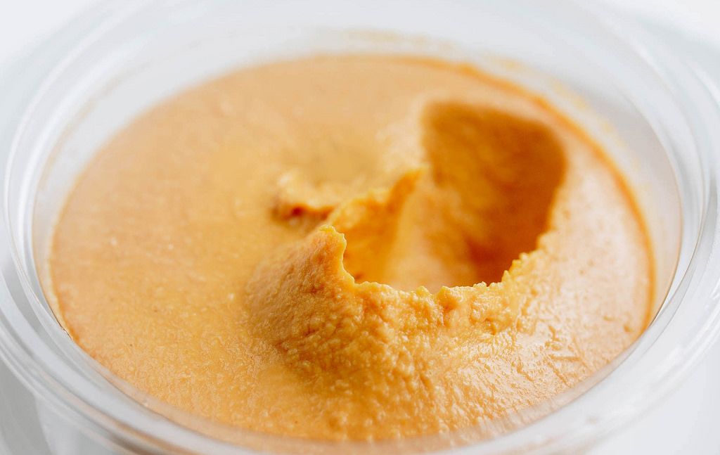 Close up of humus with pumpkin. Healthy food