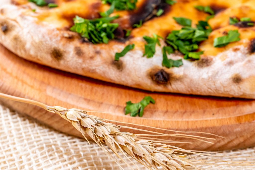 Close-up of khachapuri with greens