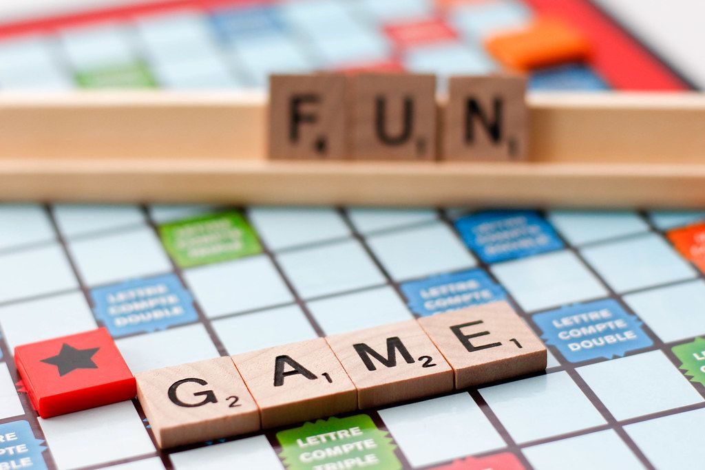 Close Up of Scrabble Board Game with Words Game and Fun