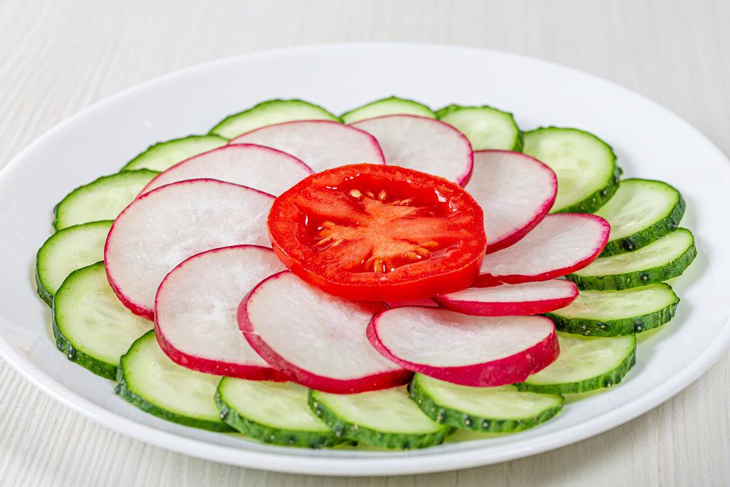 Close-up of sliced cucumber, radish and tomato (Flip 2019)