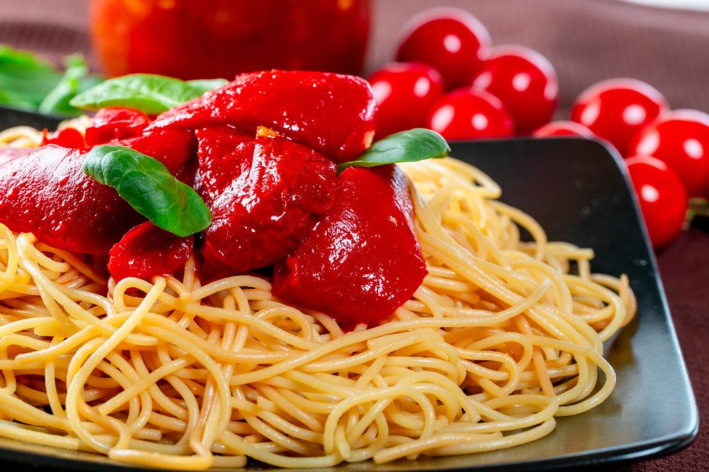 Close-up of spaghetti with sweet pepper and tomato sauce