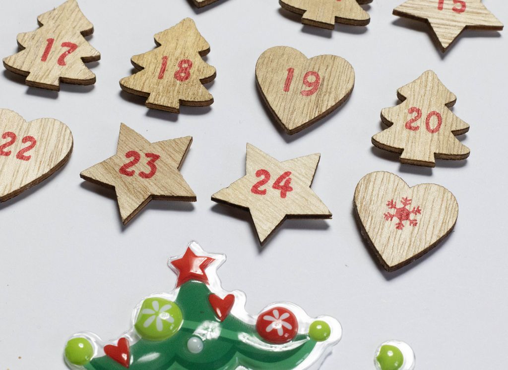 Close up of wooden Advent calendar with red numbers