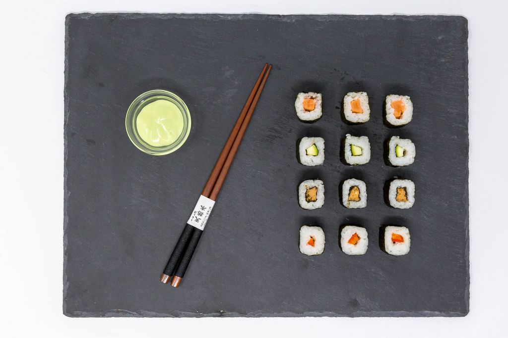 Close Up on Moso-Maki Sushi with Wasabi Dip and traditional Chopsticks