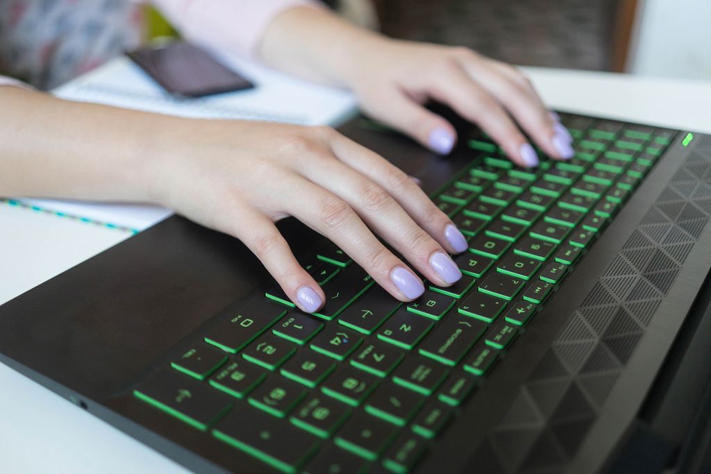 Close Up on Woman's Hands Working on the Laptop at the Office