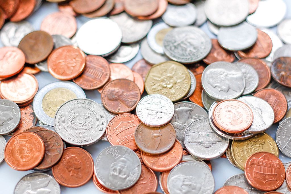 Close Up Photo of Different Shaped Coins of Different Currencies
