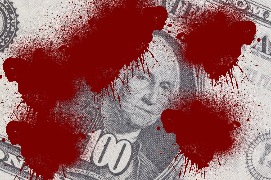 Closeup of Dollar Banknote with Red Color Spot like Blood