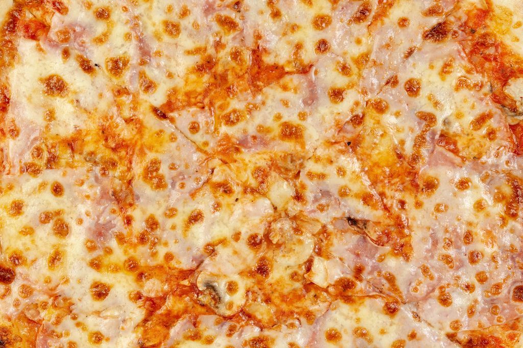 Closeup of Fresh Pizza with Ham and Mushrooms (Flip 2019)
