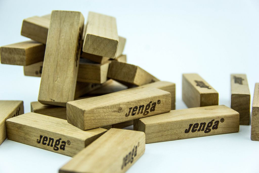 Mehr Bilder zu Jenga Tower game with wooden blocks on white background.