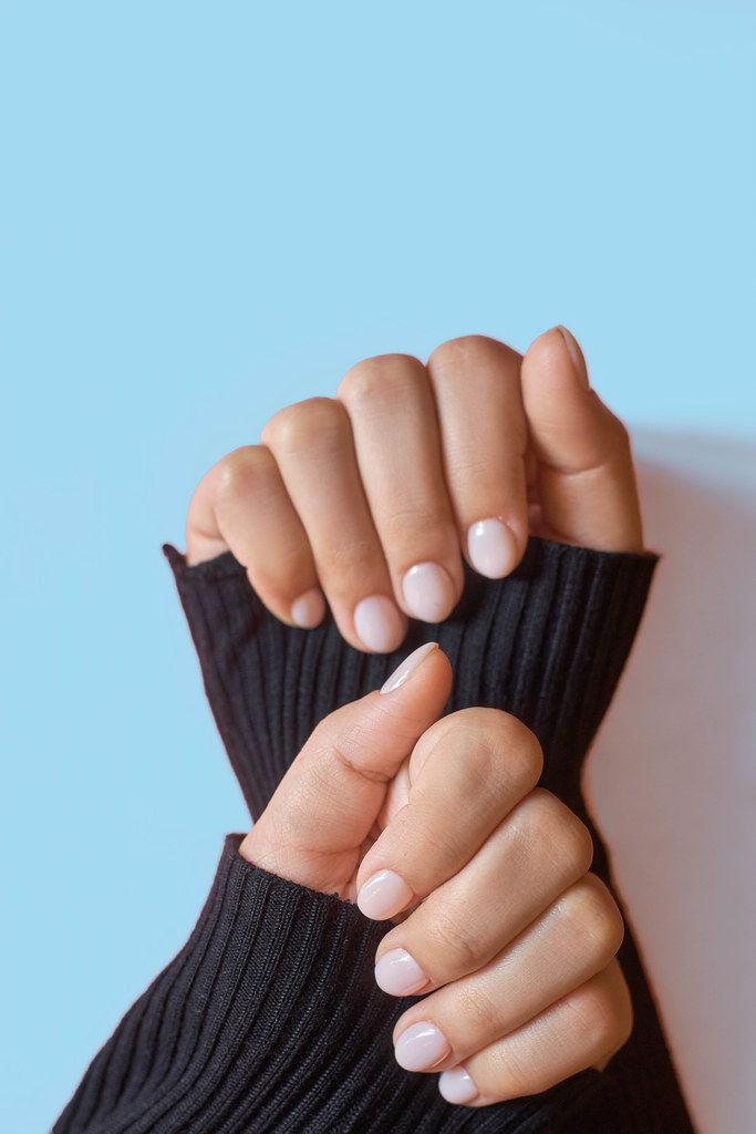 Closeup photo of a beautiful female hands with elegant manicure