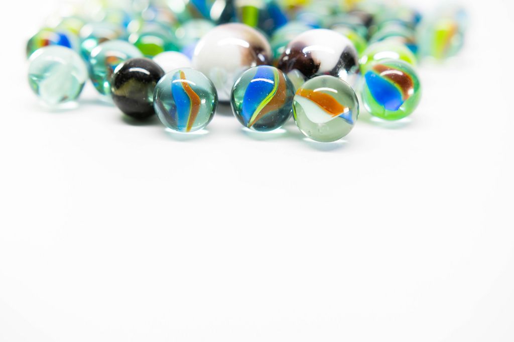 Colorful marbles on a white surface (Flip 2019)
