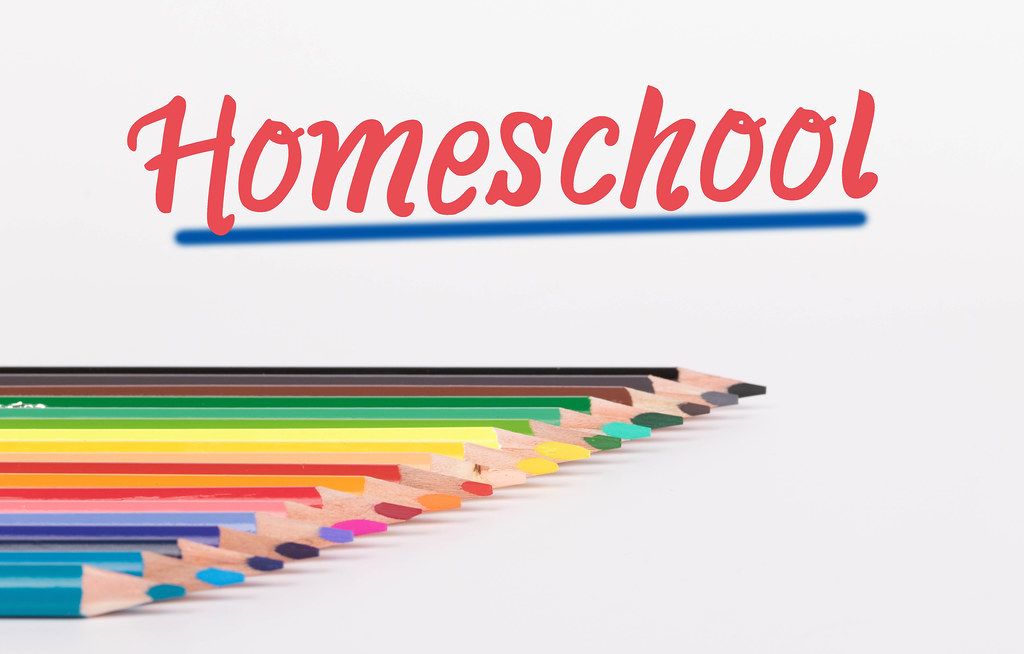 Colorful pencils on white background with text Homeschool