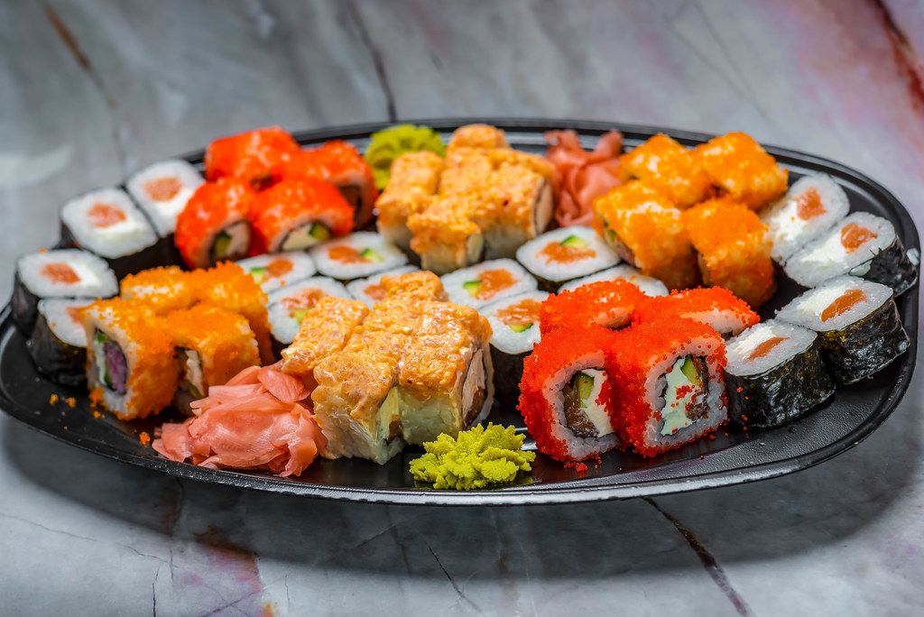 colorful Sushi Set nigiri and sushi rolls for two. Maki, scallop.