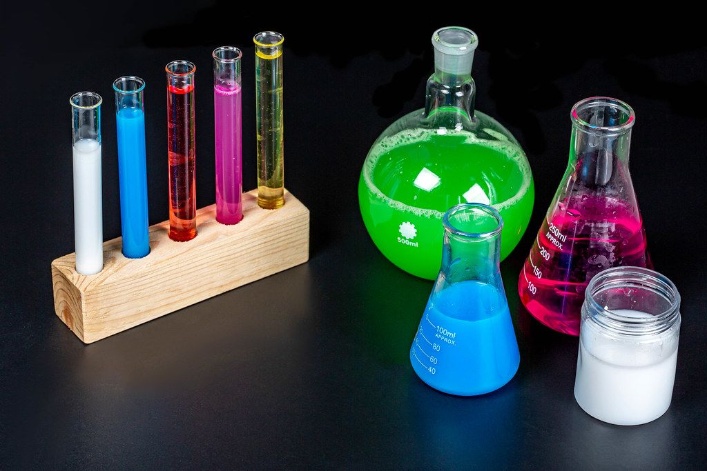 Concept pharmacy and chemistry. Test glass flasks with solutions in research laboratory