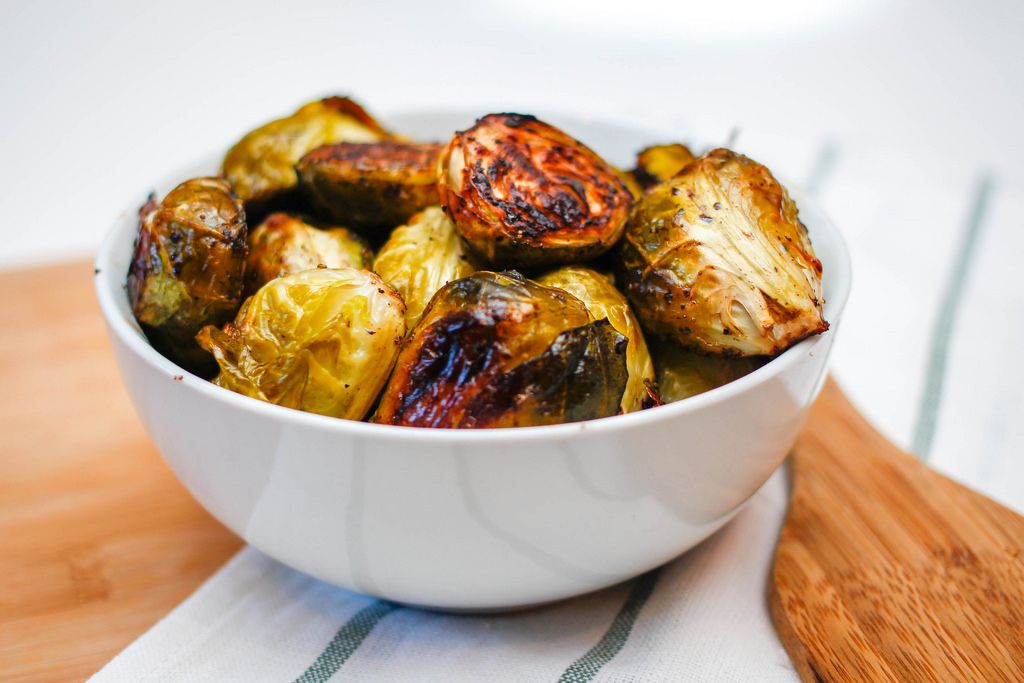 Cooked Brussel Sprouts in a White Bowl