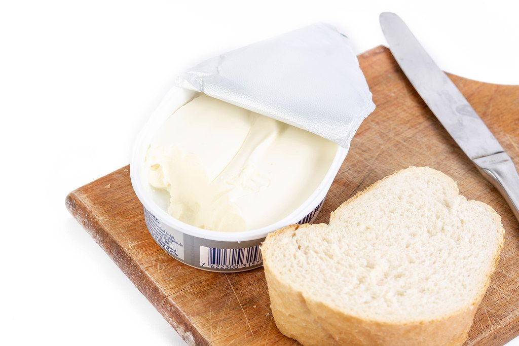 Cream Cheese with Bread and knife on the wooden board