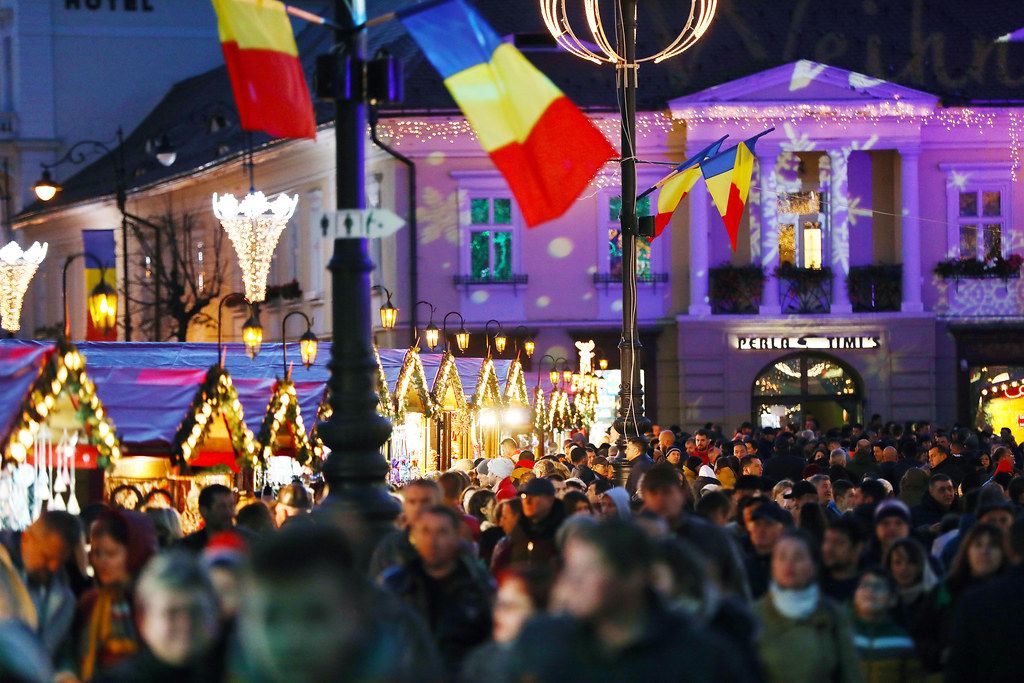 Crowded Christmas market in Sibiu, Romania, night view
