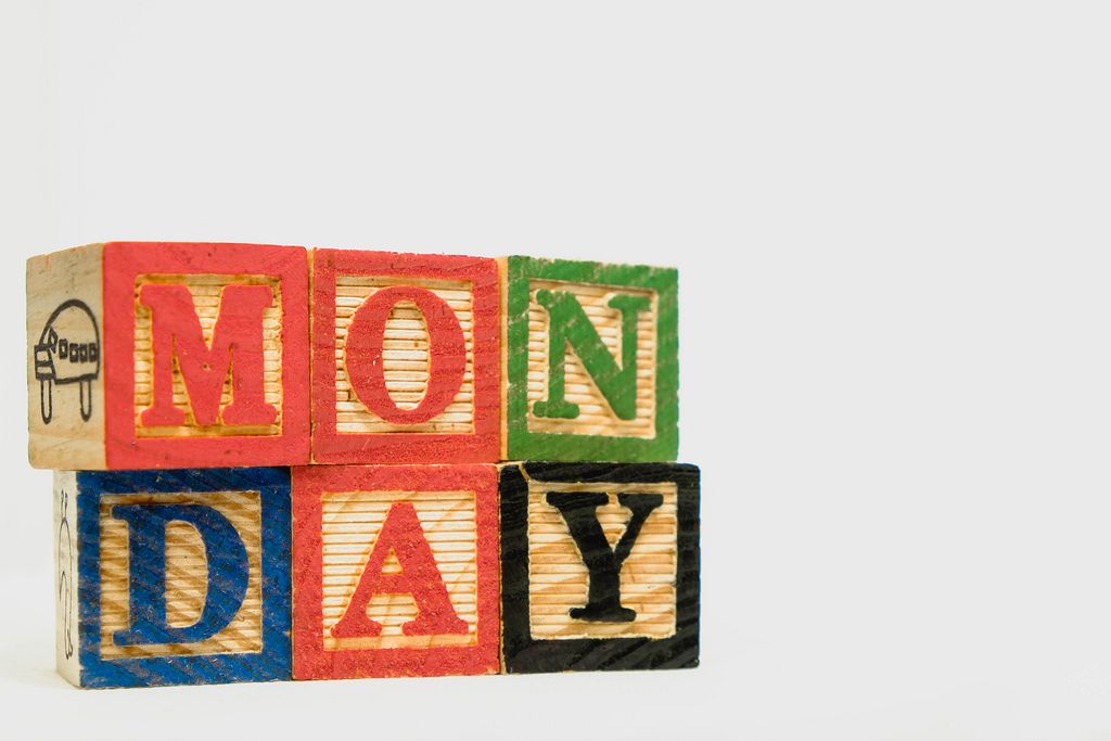 Detail shot of wooden blocks with Monday text