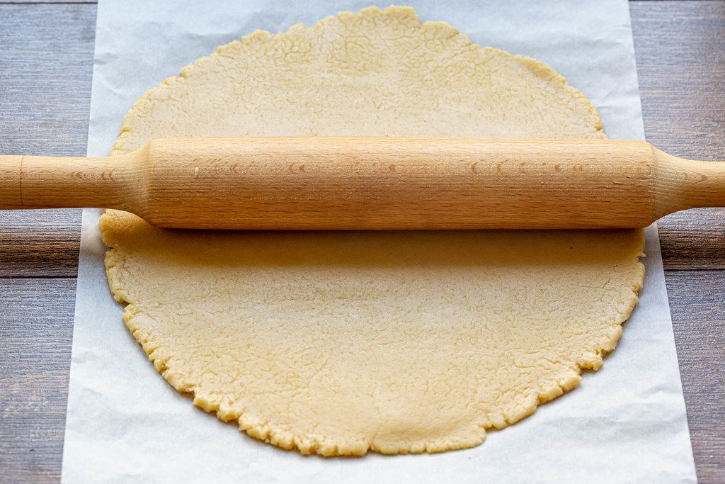 Dough for homemade cookies with rolling pin