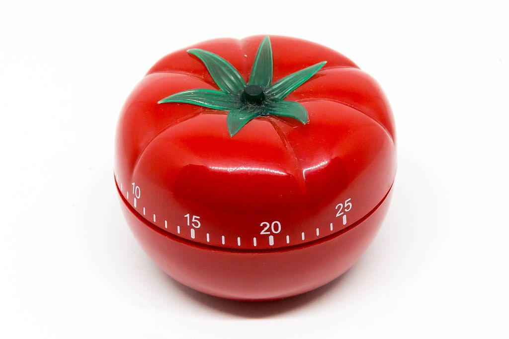 Egg Timer in Shape of Tomato on White Background for Pomodoro Technique