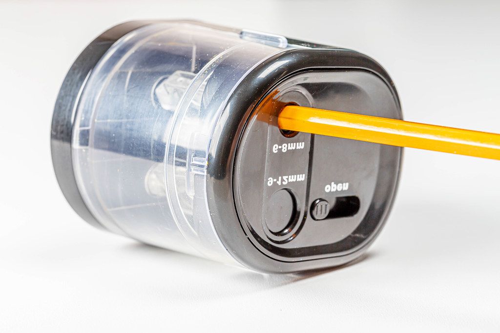 Electric black pencil sharpener with orange pencil (Flip 2020)